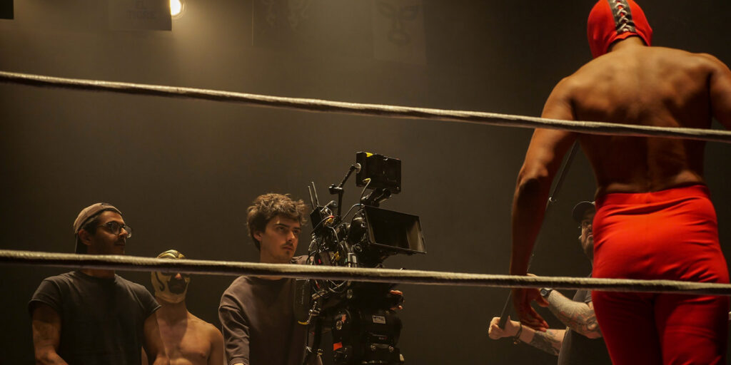 A film crew shooting a wrestler