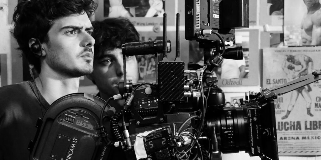 Hudson and team behind a camera