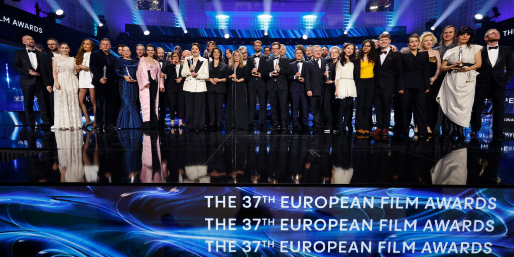 A group of people standing on stage