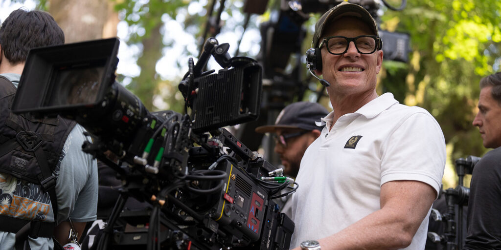 Jules O'Loughlin ASC ACS behind a large camera