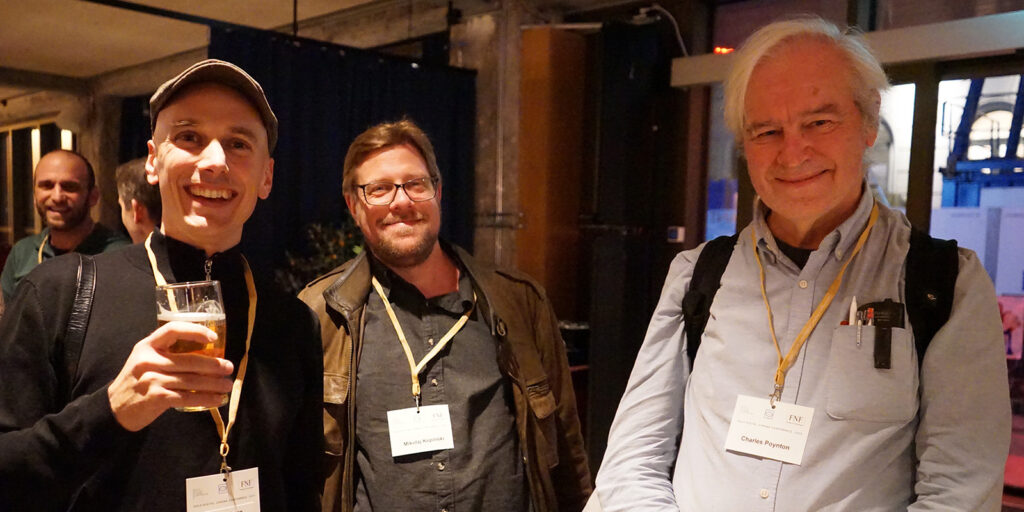 Three people smiling together