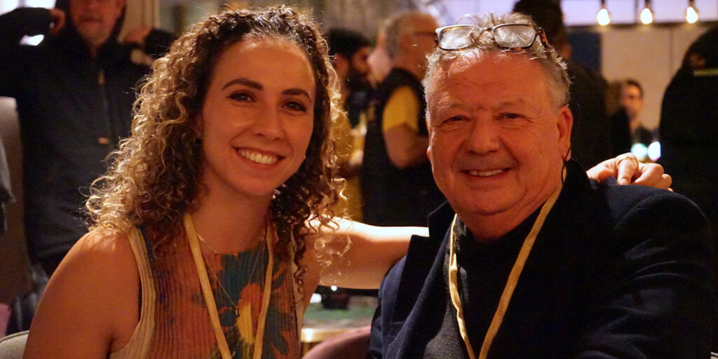 Two people smiling together
