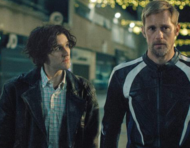Two men walking together looking tense