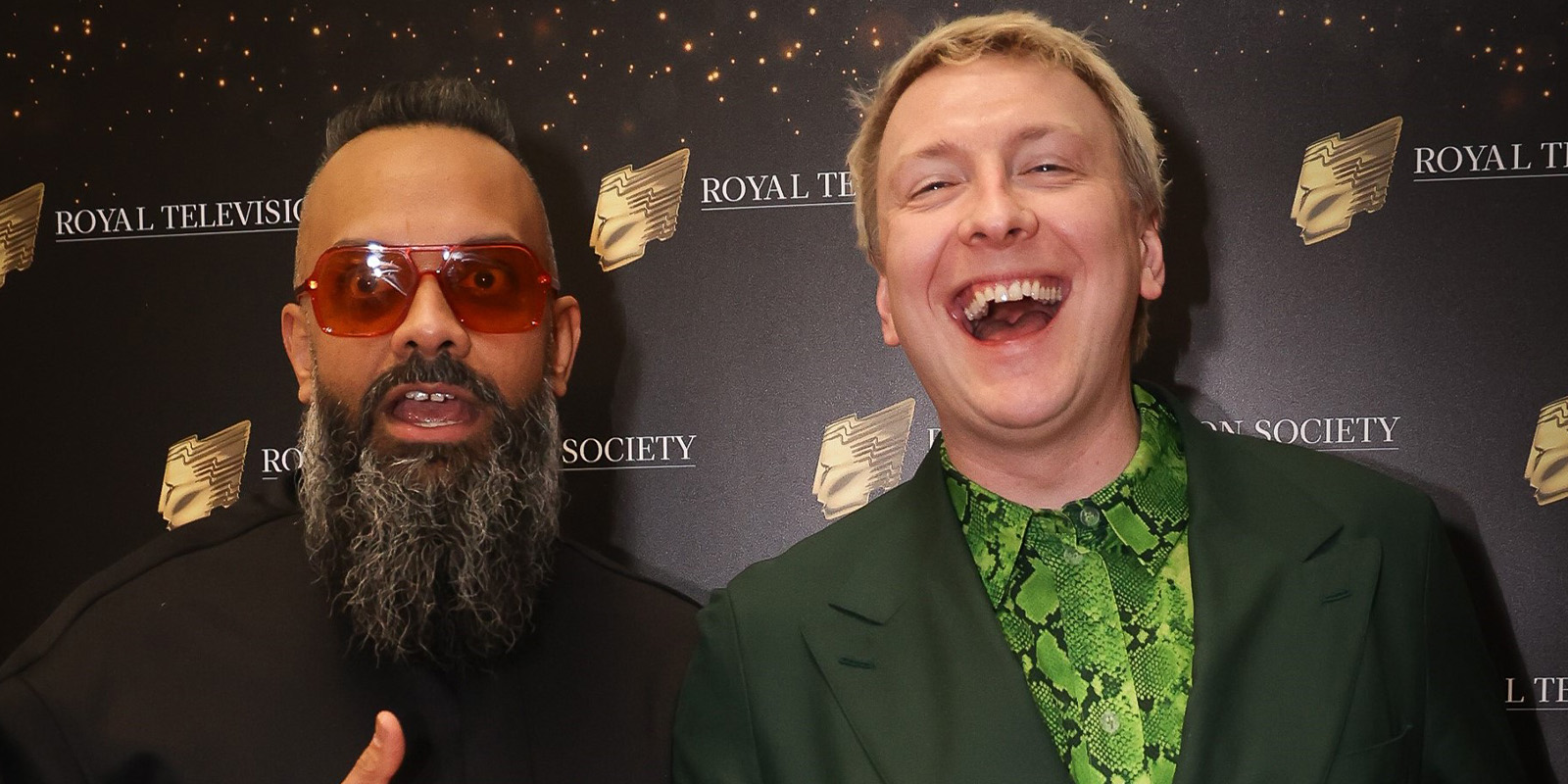 Guz Khan and Joe Lycett smiling together