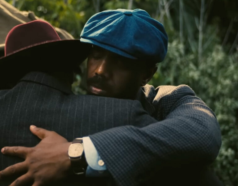 Michael B Jordan hugging a man