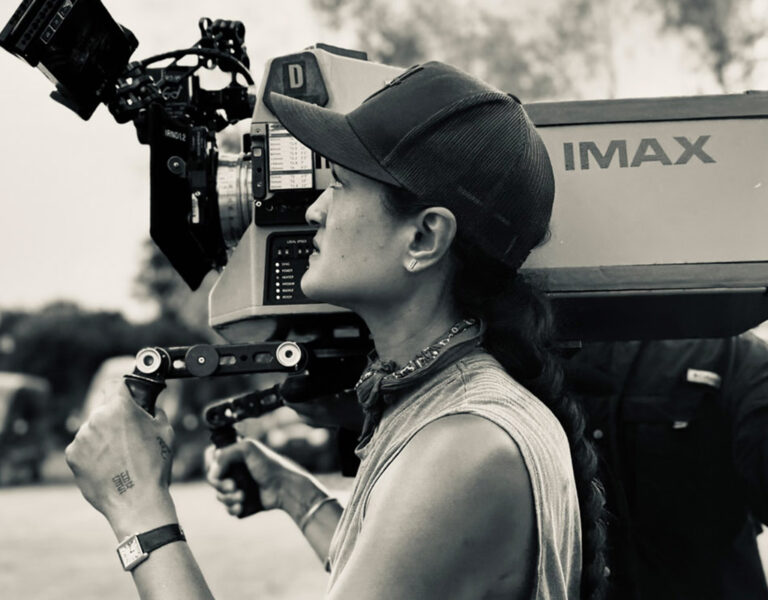Autumn Durald Arkapaw ASC with a camera on her shoulder