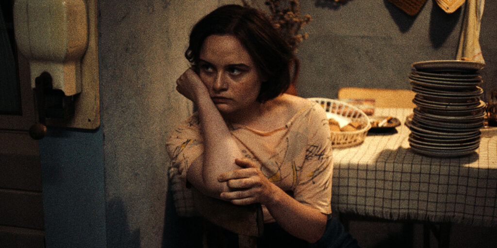 A woman sat looking sad