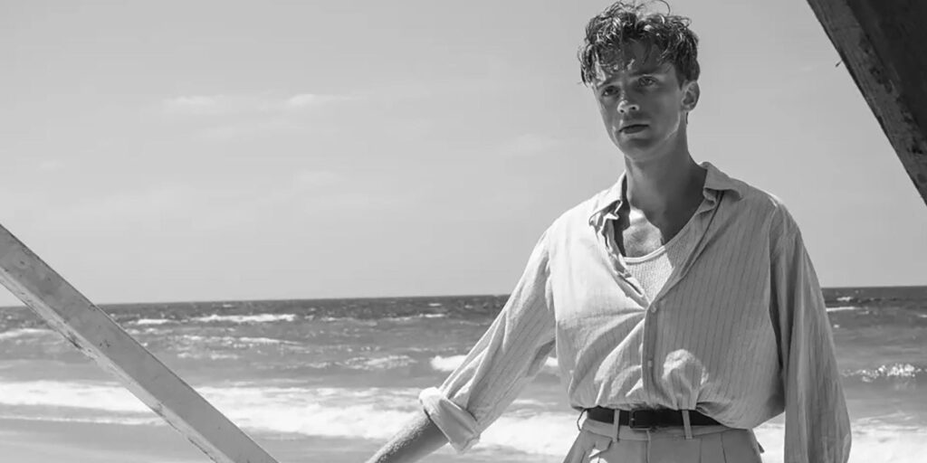 A man standing by the sea