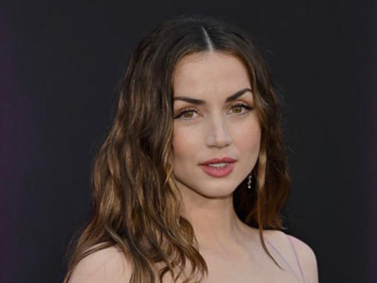 Ana de Armas smiling into camera