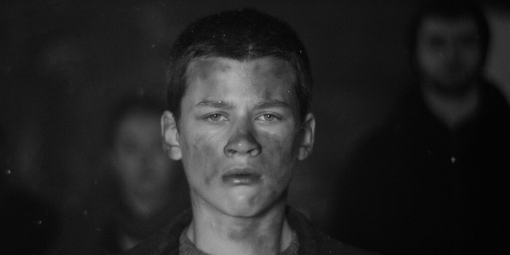 A boy staring into camera
