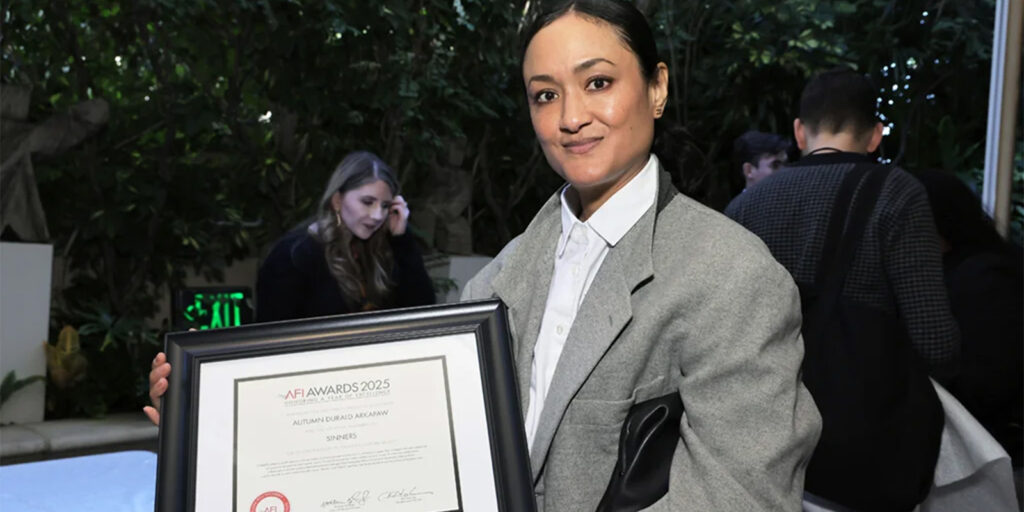 Autumn Durald Arkapaw holding an award