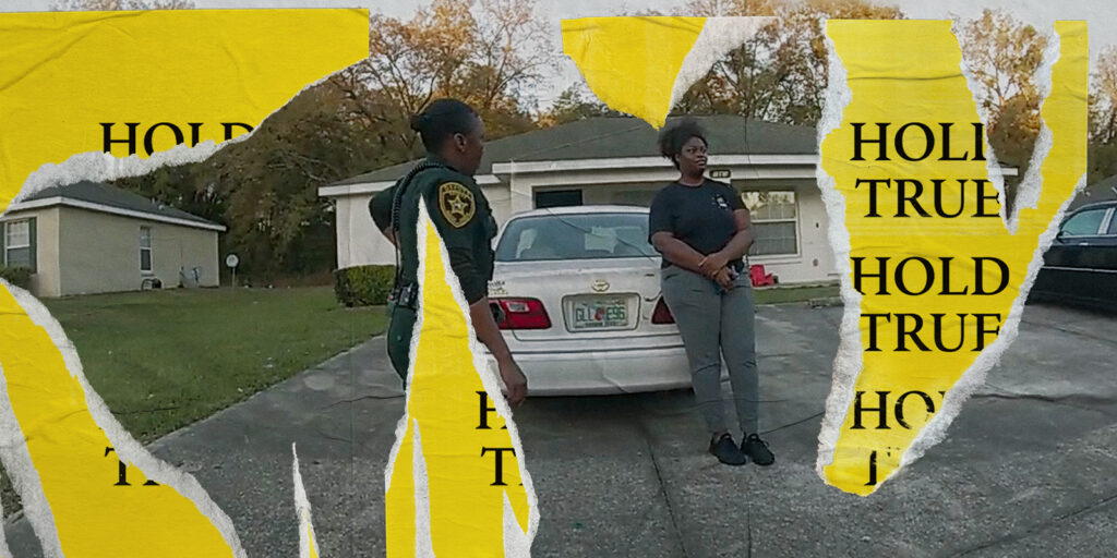 Two people stood by a car