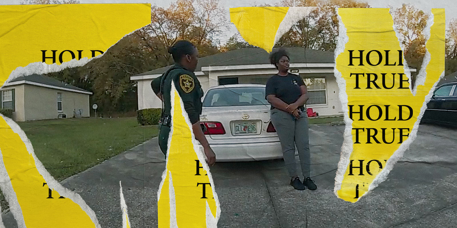 Two people stood by a car