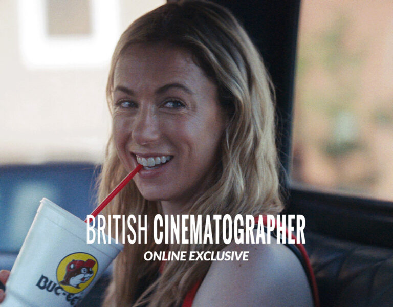 A woman drinking in a car