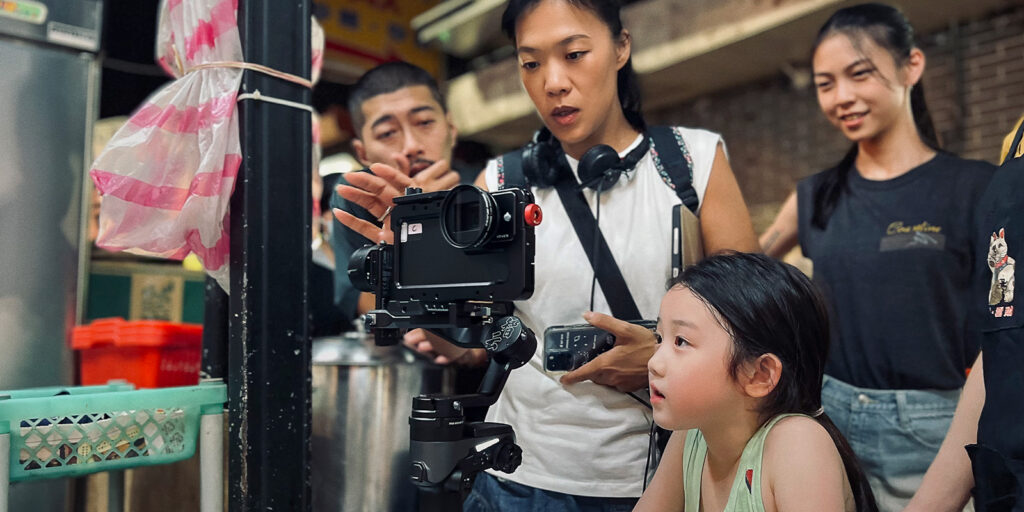 Film crew with a girl on set 