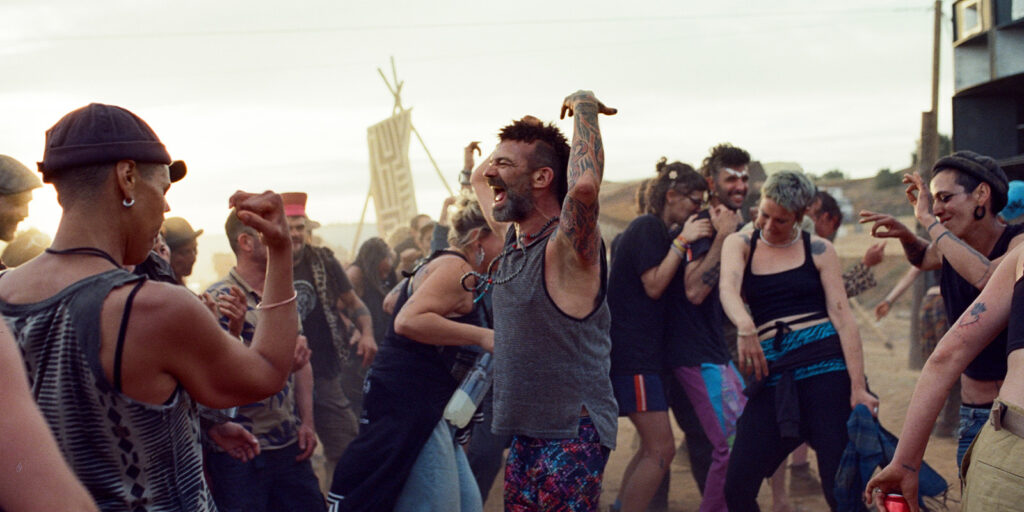 People raving together in the desert