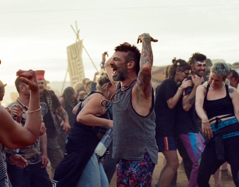 People raving together in the desert