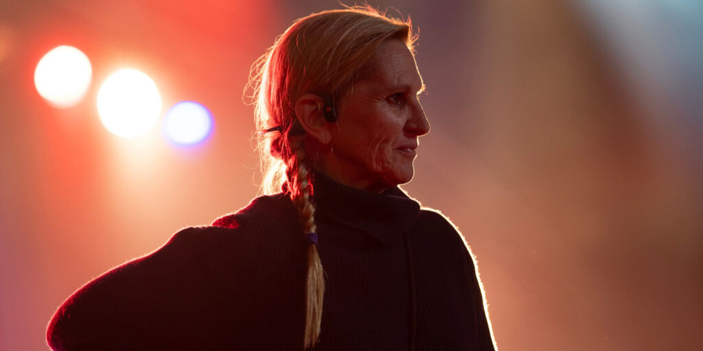 Amy Vincent standing with a smirk