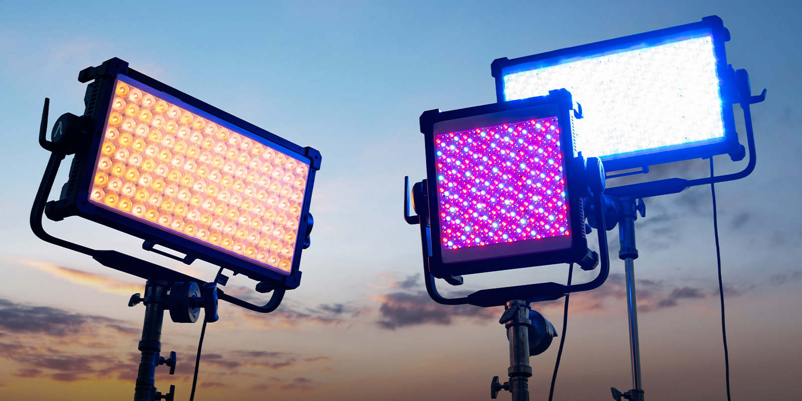 Three lights against a blue sky