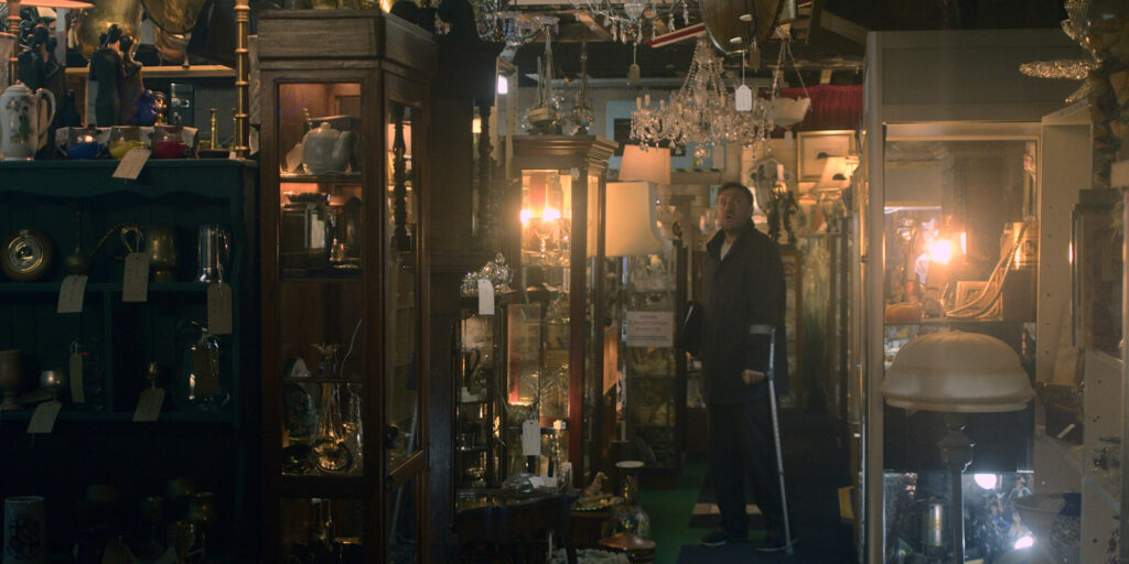 A man stood in a full shop