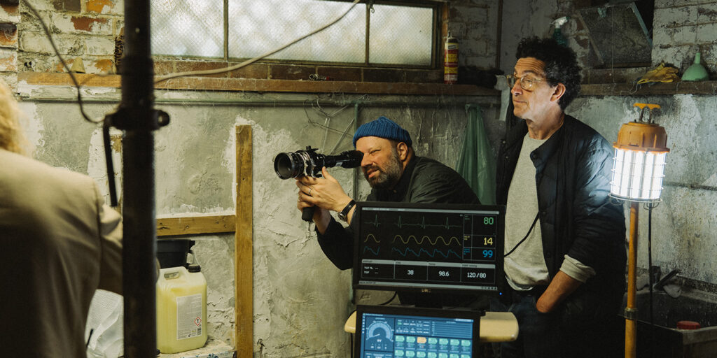 Film crew gathered in a basement