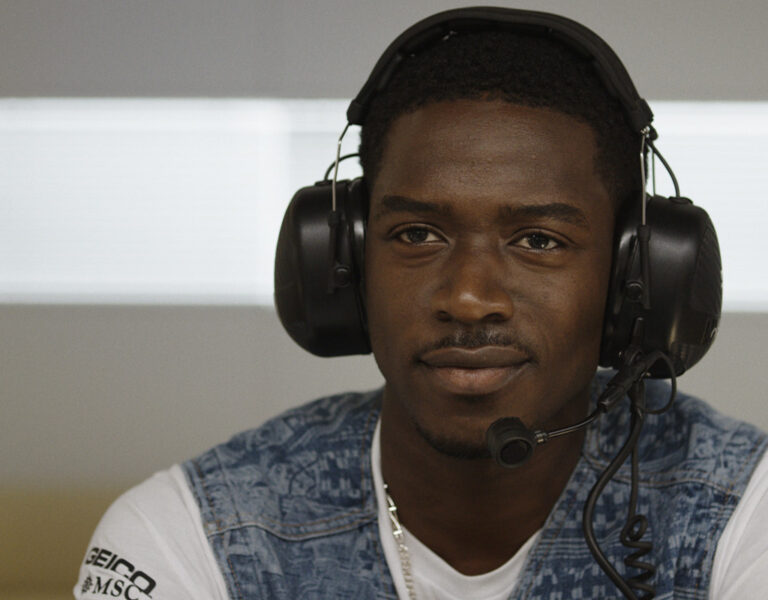 Damson Idris wearing headphones