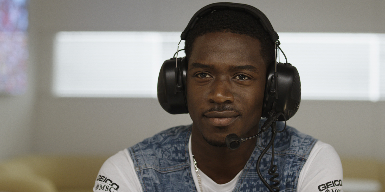 Damson Idris wearing headphones