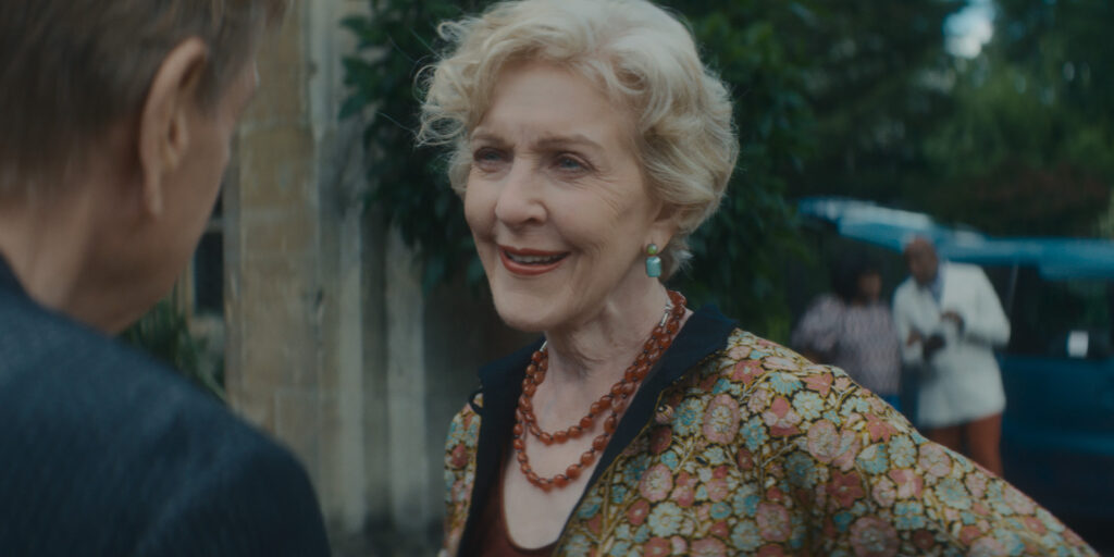 Patricia Hodge smiling at Timothy Spall