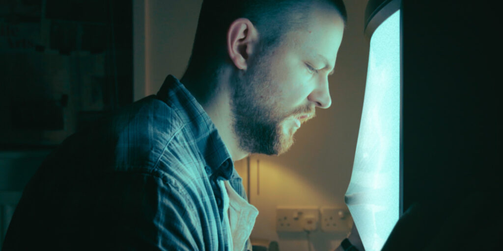 A man looking out of a window
