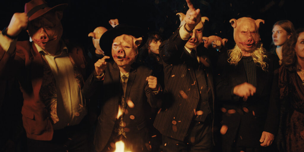 People in pig masks chanting
