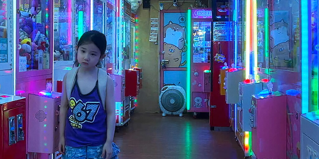 A little girl in an arcade