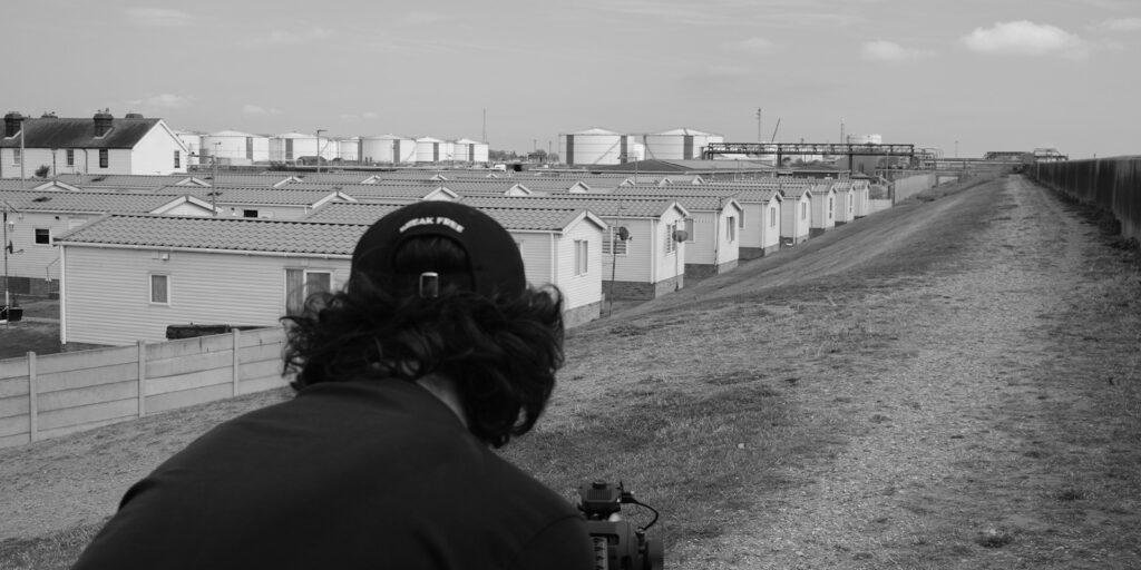 A man shooting a seaside town