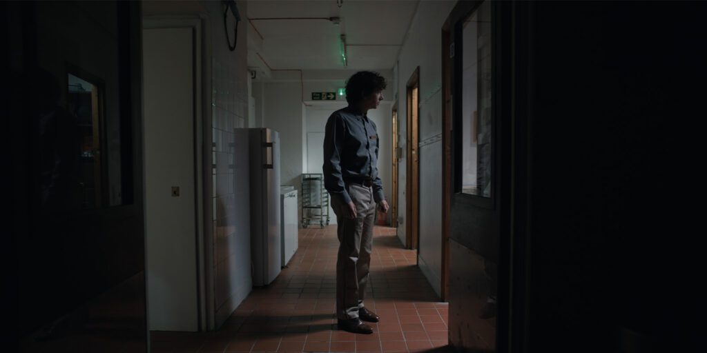 A man standing in a hallway