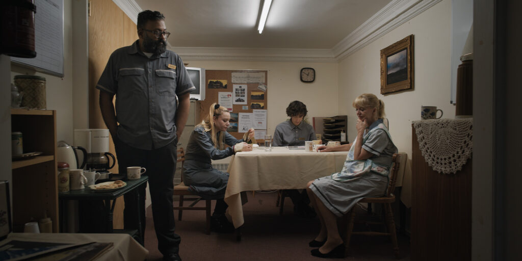 A group of people in a hotel kitchen