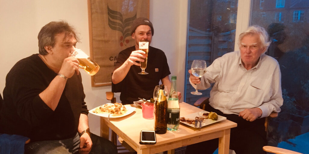 Three people drinking beer