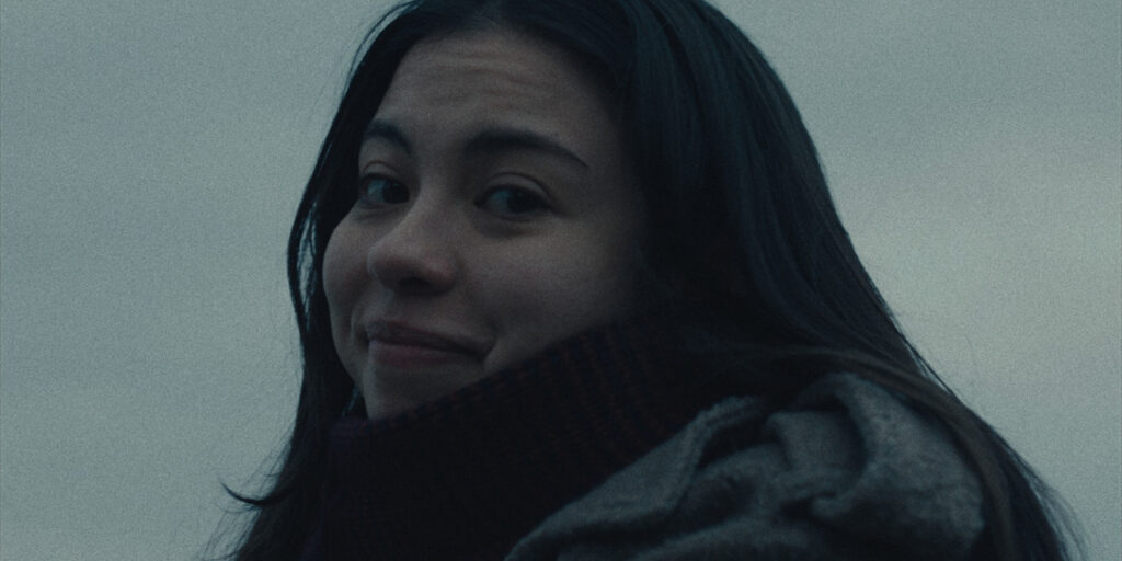 A woman smiling into camera