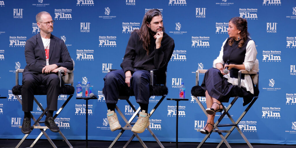 Three directors talking on a panel