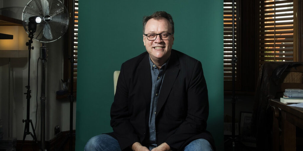 Russell T Davies smiling into camera