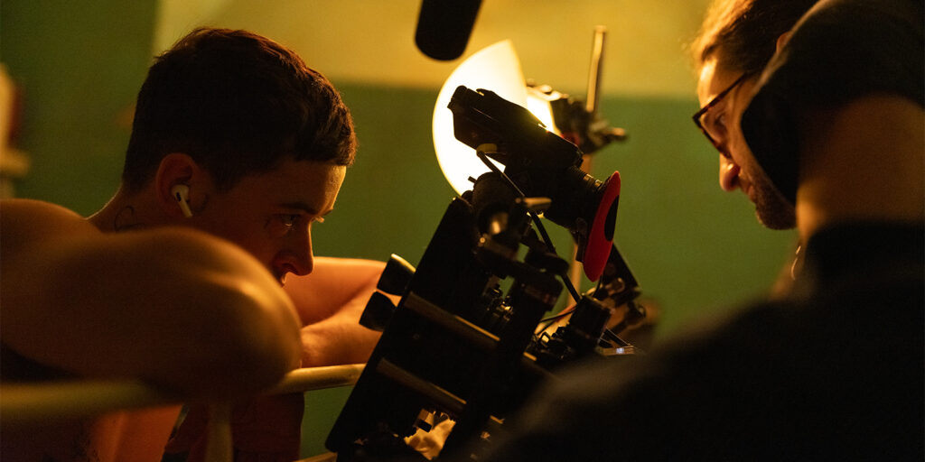 Levrini shooting a scene with Tom Blyth