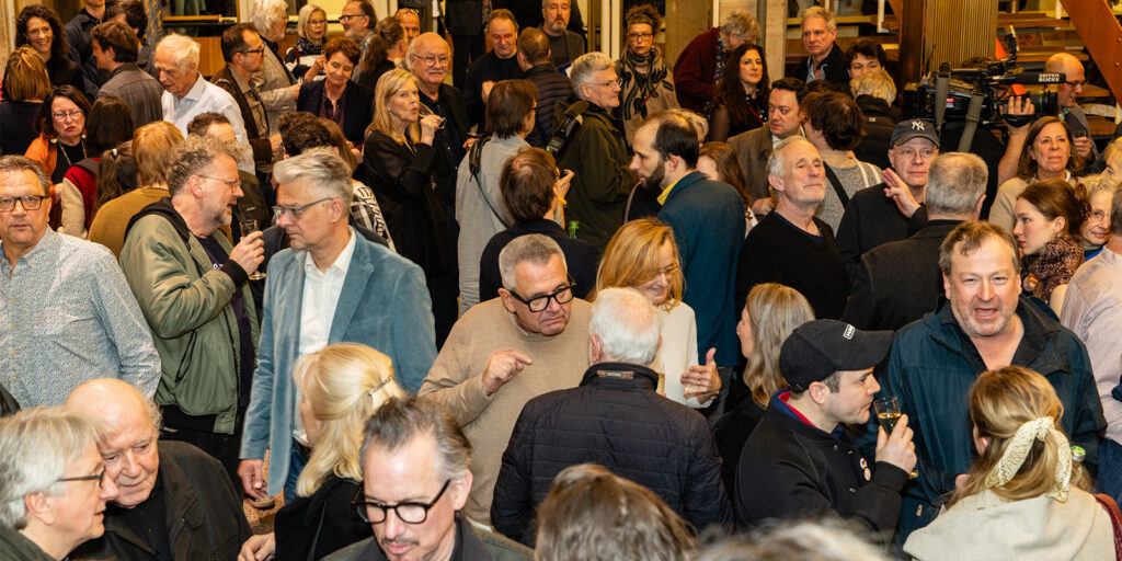 A group of people talking together 