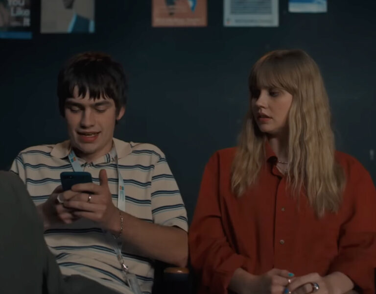 Two people sat together on a sofa