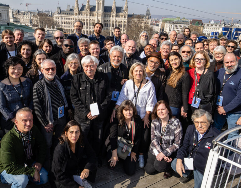 A group of people gathered on a roof in Vienna