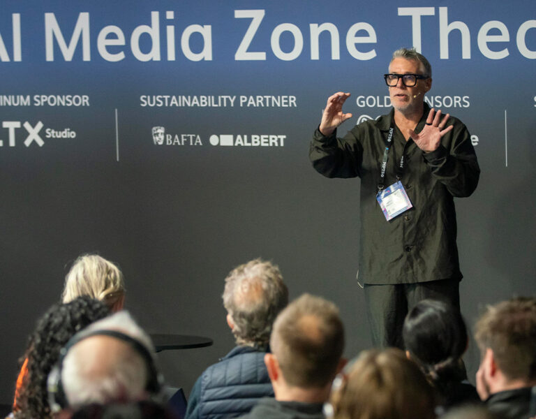 A man talking to a crowd on stage