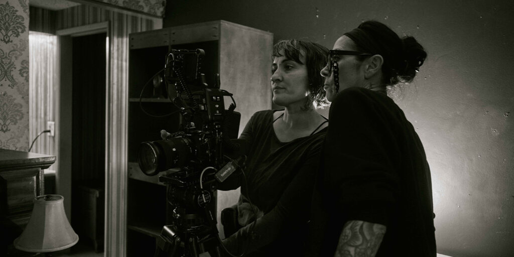 Two people gathered on set together