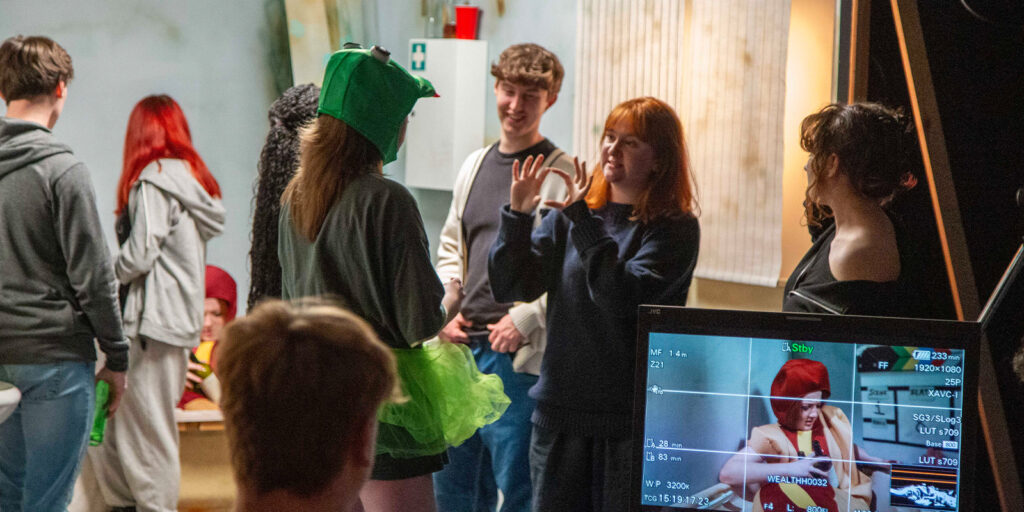 A group of film students on set