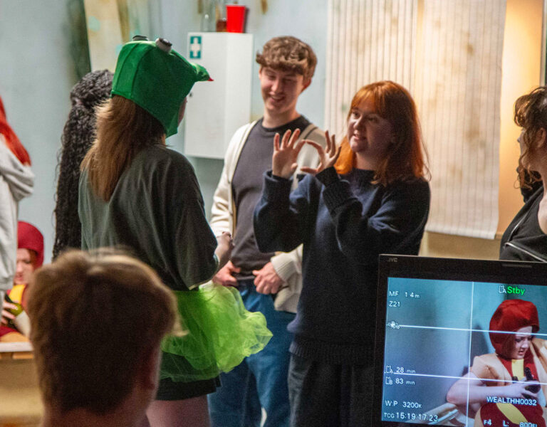 A group of film students on set
