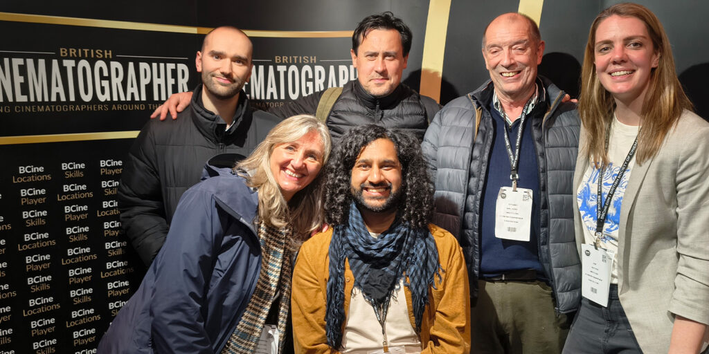 Six people, four standing and two sitting in front, smile for a group photo at the BSC Expo 2026, with a “British Cinematographer” backdrop. All wear event badges around their necks at this lively event review moment.