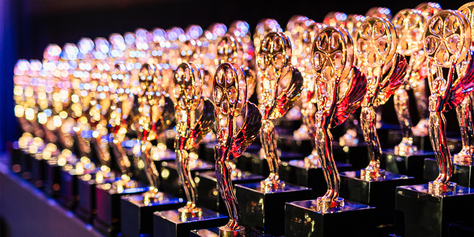 A table full of golden trophies