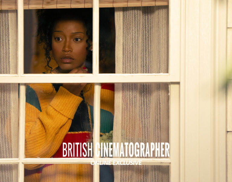 Keke Palmer looking through a window looking shocked