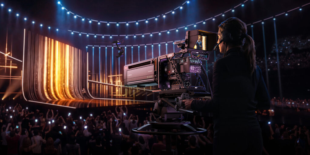 A woman using a camera to shoot a live event